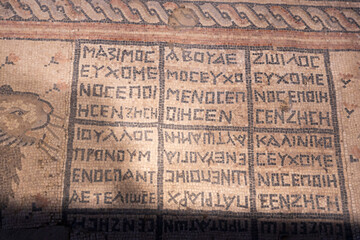 Tiberias, Israel, November 11, 2025 — of the mosaic floor displaying a clear grid of ancient greek letters,. from the Hammat Tiberias Synagogue floor.