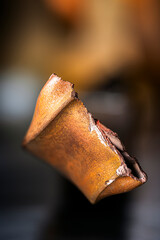 Oxidized broken copper profile, non-ferrous metal scrap, close-up of copper structure with industrial soft background