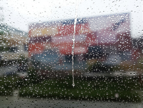 Raindrops on Window Glass with Blurred Abstract Background - Powered by Adobe