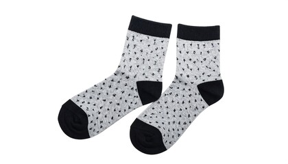 Two patterned socks. One displays a light-colored fabric with black specks and a black top, heel, and toe. The other matches, offering an angle for full display