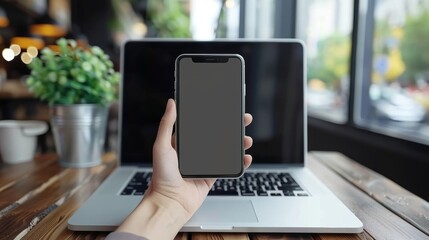 Businessman using mobile device while sitting at a table for professional communication