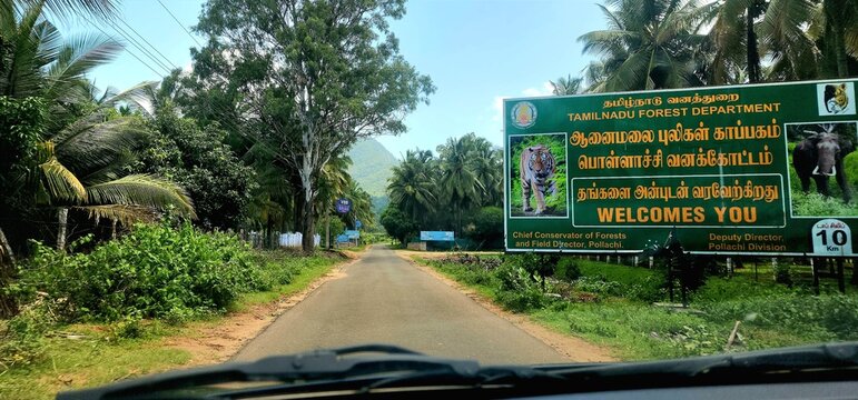Pollachi, Tamilnadu, India - June 7, 2025: Visitors arriving at the entrance of Anamalai Tiger Reserve checkpost in Pollachi, known for its rich biodiversity and scenic forest landscapes