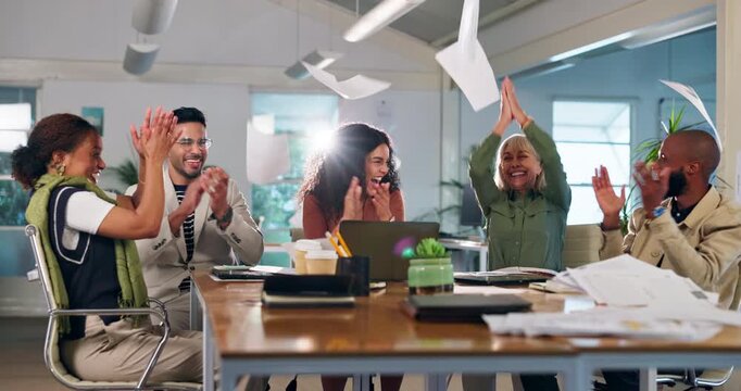 Meeting, celebration and business people with documents in air for teamwork, project success or achievement. Interior design, paperwork and staff cheer for growth, target or financial goal in office