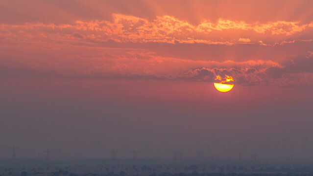 Sunset in Ajman aerial view from rooftop timelapse. United Arab Emirates.