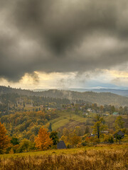 Obraz premium Misty Autumn Rain Clouds over Ukrainian Carpathian Mountains.