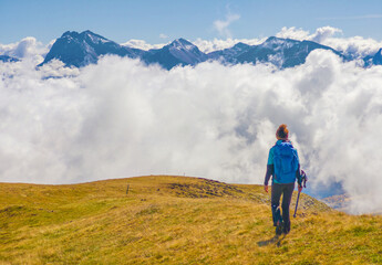 Monte Gorzano, Italy - The highest peak in the mountain range named Monti della Laga, with Cento Fonti waterfalls and hikers who practice trekking in altitude, in autumn with foliage