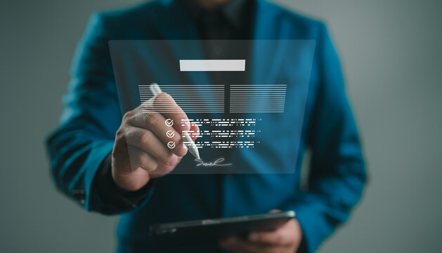 Businessman signing digital contract using stylus on virtual interface, representing e-signature, online agreement, paperless documentation, and secure digital workflow in modern business systems.