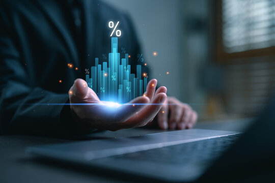 Businessman holding digital bar chart with percent icons, symbolizing big data analytics, financial forecasting, interest rate trends, and maximizing profit through smart investment strategies.
