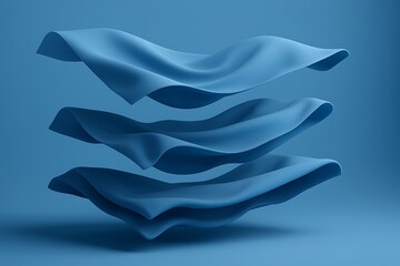 Three layers of flowing blue fabric suspended in air