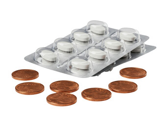 Isolated cost of healthcare a blister pack of pills and copper coins on the surface