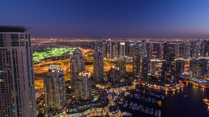 Obraz premium Dubai Marina with yachts day to night aerial timelapse