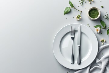 Clean table setting with plate, fork, knife, and spring decor