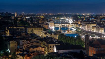Fototapeta premium Skyline view of Arno River day to night timelapse, Ponte Vecchio from Piazzale Michelangelo at Sunset, Florence, Italy.