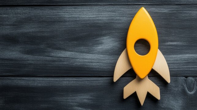 A vibrant yellow rocket toy is set against a dark wooden background, symbolizing creativity and adventure, This image is perfect for children's products, educational materials