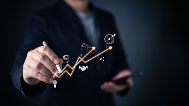 businessman touch graph with a virtual interface, leveraging technology for a business plan, industry insights, and achievement. Driving growth through advertisement and analyzing trend in e-commerce.