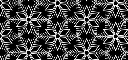 Large white snowflakes on a black background. Pattern and texture. Geometric patterns