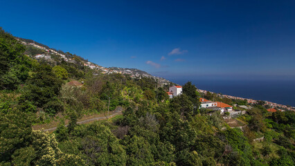 Fototapeta premium Aerial view from the mountain over the rooftops from cable car on Madeira timelapse hyperlapse.