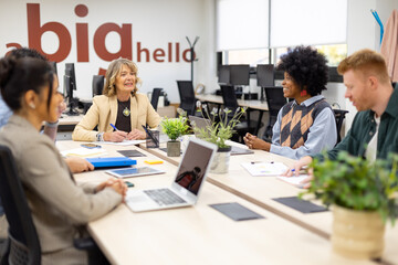Diverse business team collaborating during office meeting