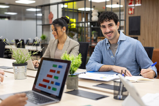 Business professionals working in modern office meeting