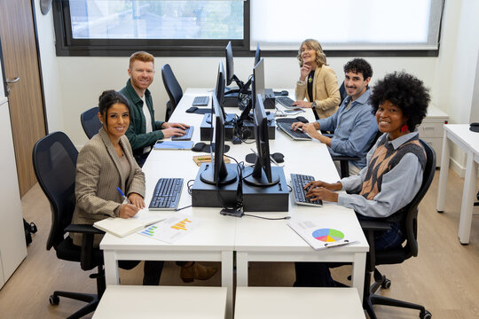 Diverse business team collaborating in shared office space