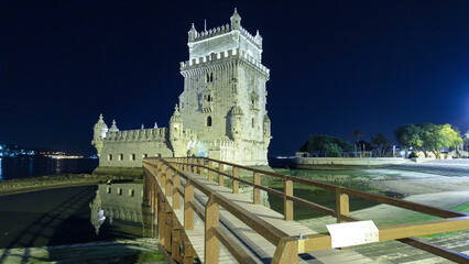 Belem Tower on Tagus River night timelapse hyperlapse. Lisbon, Portugal.