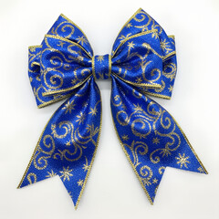 A bow made of blue and gold fabric for decoration Christmas tree on white background