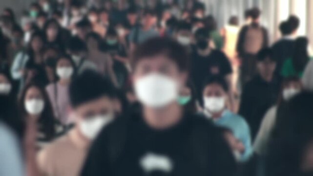 Large crowd of business people with medical face mask. Air pollution. Blurred defocused view of Concept of coronavirus, covid 19 quarantine,	