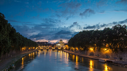 Obraz premium St. Peter's Basilica, Saint Angelo Bridge and Tiber River after the sunset day to night timelapse
