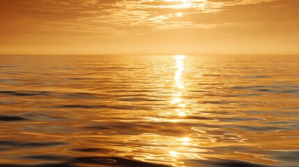 Serene Sunset Over Calm Ocean Waters Reflecting Warm Golden and Orange Hues Under a Softly Cloudy Sky at Dusk for Tranquil Atmosphere