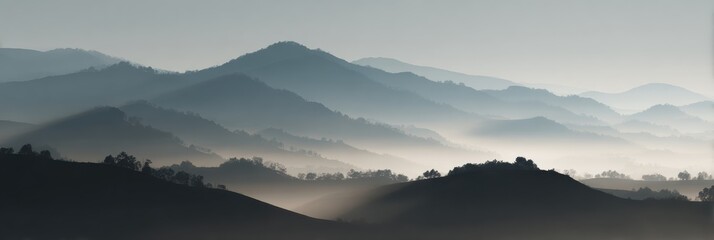 Fototapeta premium Mountain Landscape Shrouded in Mist Offers Quiet Moments of Reflection and Peace During Early Dawn Light