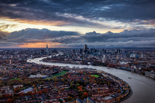 Panoramic view of the urban skyline of London, England, stretching from south to north during a moody autumn sunset with clouds - Powered by Adobe