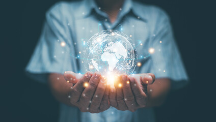 Global connectivity and digital transformation concept. Hands holding holographic earth with network connections. Worldwide communication, technology integration, innovation and sustainability.