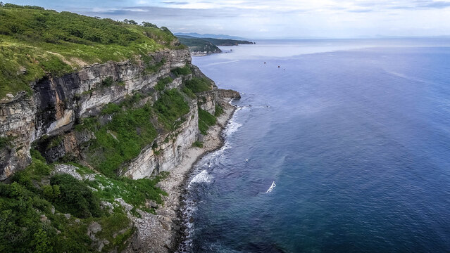 Aerial photo of rocky cliffs descend to Ussuri Bay clear shoreline near Vladivostok, Primorye, Russia.
- Powered by Adobe