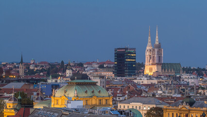 Fototapeta premium Zagreb cathedral and modern skyscraper with a old city panorama day to night timelapse