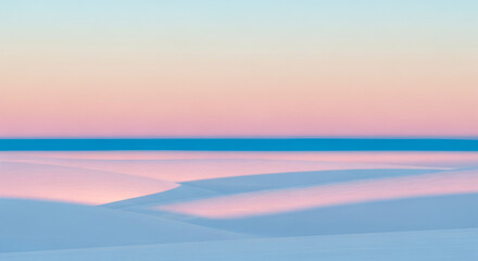 Image shows sandy dunes under soft, pastel gradient sky with thin, blue horizon line, conveying serene beauty and peaceful desert landscape