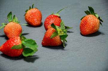 Close up photo of fresh strawberry isolated on gray background