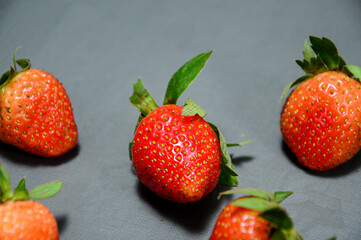 Close up photo of fresh strawberry isolated on gray background