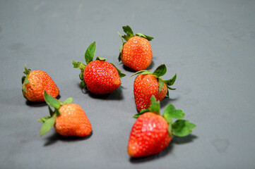 A photo of fresh strawberry on gray background 
