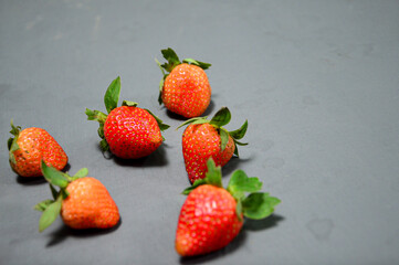 A photo of fresh strawberry on gray background 