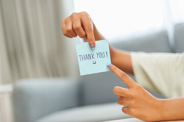 Thank you note gesture modern home personal message bright room close-up appreciation concept