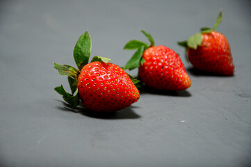 Fresh strawberry isolated on gray background 