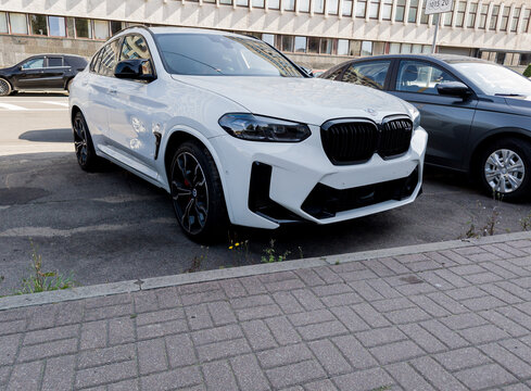 BMW X4 M parked in city streets