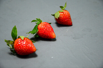 Fresh strawberry isolated on gray background 