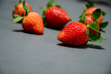 A photo of fresh strawberry on gray background 