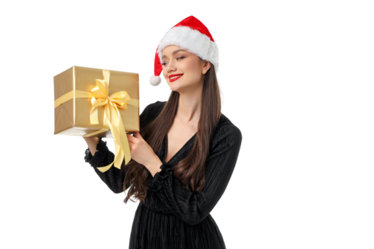 Woman in a Santa hat smiles with a gift