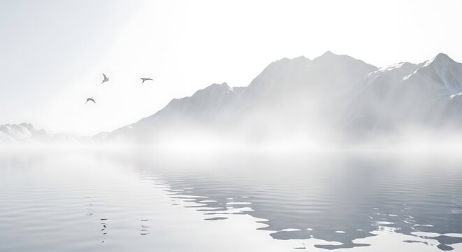 Birds flying over a misty lake and mountain range