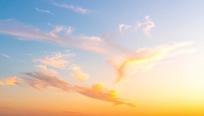 Obraz premium Serene sunset sky with soft clouds vibrant colors creating a peaceful and tranquil atmosphere.