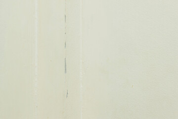 The corner wall surface with a white concrete pillar