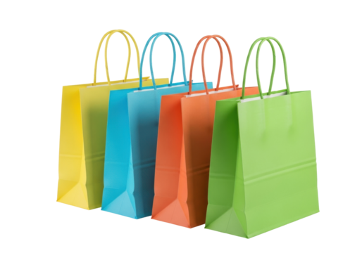 Colorful paper shopping bags PNG isolated on transparent background, yellow blue orange and green gift bags for retail and commerce