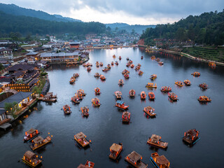 Traditional Chinese-style, tourist boats in dam or lake at Baan, Rak, Thai, Village Mae Hong Son, Thailand.